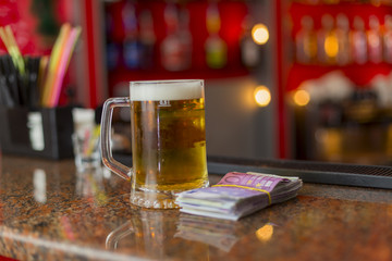 mug of beer and money