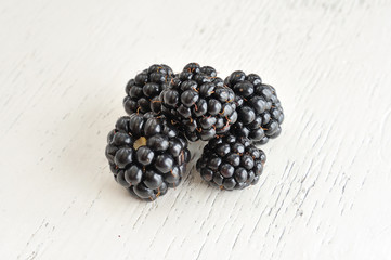 Blackberries on White Wooden Background