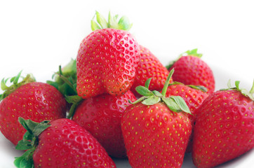 Fototapeta na wymiar Three fresh strawberries isolated on white background.