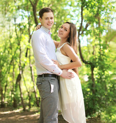 Fototapeta premium Pretty young couple in love enjoying summer time