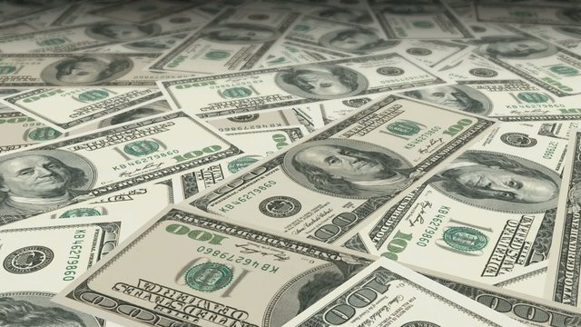Dolly shot across $ 100 bills money banknotes