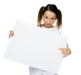 Trendy young girl holding to a blank card
