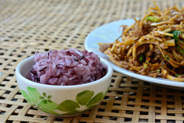 spicy banana bud with pork salad  and black sticky rice on bambo