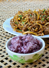 spicy banana bud with pork salad  and black sticky rice on bambo
