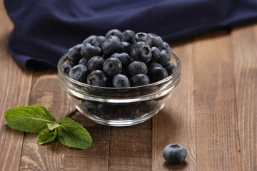 Fresh blueberries in a glass bowl