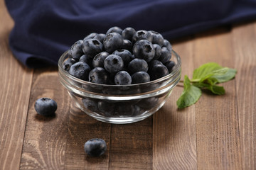 Fresh blueberries in a glass bowl