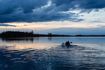 Sunset kayaking at lake