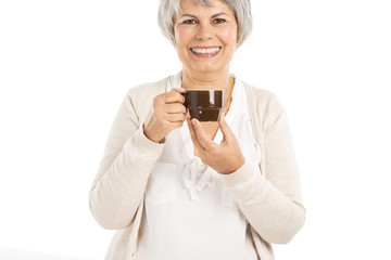 Elderly woman drinking coffee