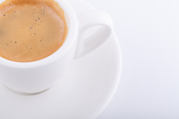 White cup of coffee on white background
