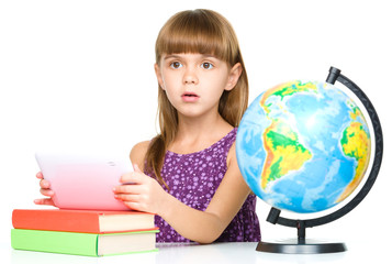 Young girl is using tablet