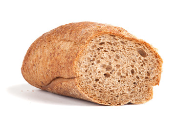 Sliced ​​black baguette with crumbs isolated on white backgr