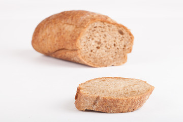 a piece of black baguette isolated on white background