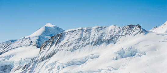 Fototapeta na wymiar Snow Mountain Range Landscape with Blue Sky from Jungfrau Region