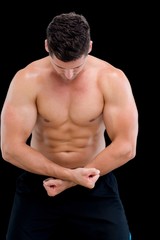 Shirtless muscular man posing