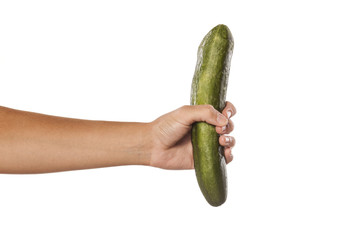 female hand holding a cucumber on white background