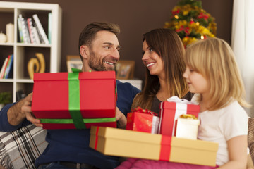 Obraz na płótnie Canvas Happy family in christmas time at home