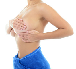Woman with perfect body examining her breast of mastopathy or ca