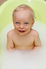 happy baby having bath