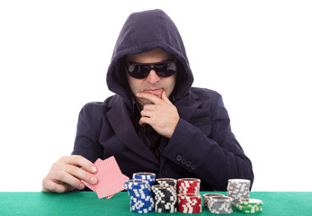 Thoughtful poker player isolated on a white background