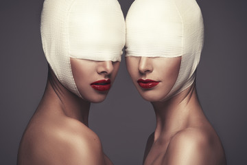 Two beauty woman with bandage