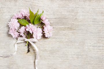 Beautiful flowering almond (prunus triloba) on wooden background
