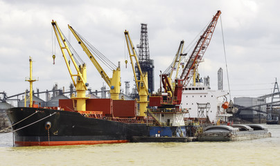 Fototapeta na wymiar Cargo ship loading in the port.