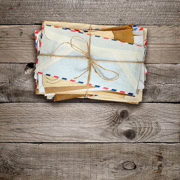 Bunch Of Old Envelopes On Wooden Background