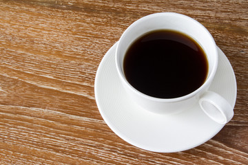 Cup of coffee on wooden table