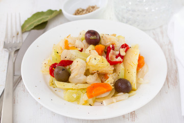 salad fish with vegetables on plate