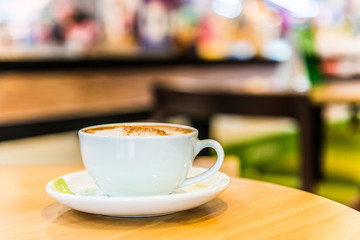 Coffee cup in coffee shop interior