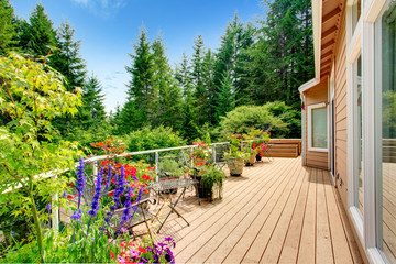 Wooden walkout deck with vibrant color flowers