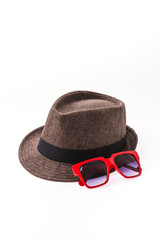 Hat , sunglasses isolated on white