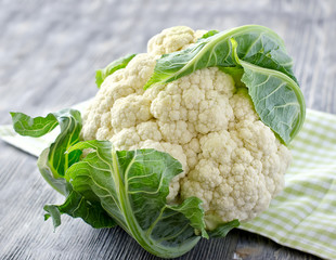 Fresh cauliflower on wooden background for cooking