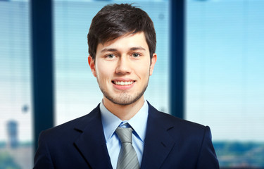 Smiling young business man portrait
