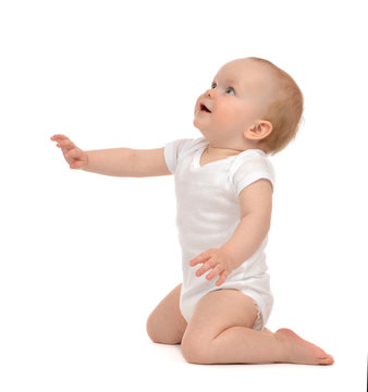 Infant Baby Toddler Sitting Hand Pointing And Looking Up