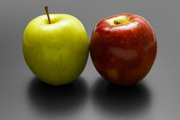 Two apples on black background