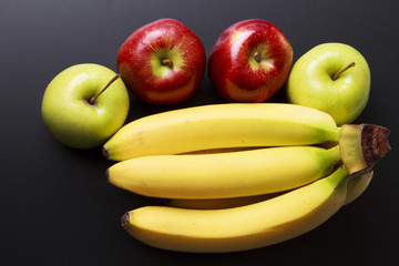 Delicious group of fruit on black background
