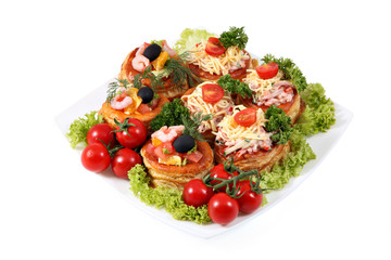 Assorted sandwiches with cheese, ham, shrimp and salmon on white