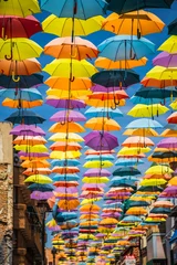 Wandcirkels tuinposter Street decorated with colored umbrellas,Madrid © Lukasz Janyst