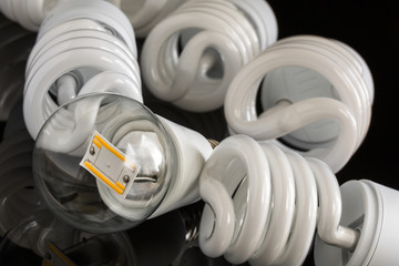 Led bulb between several CFL lamps