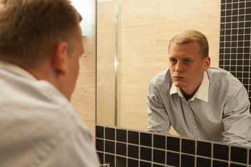 Fototapeta premium Man with hangover in a bathroom