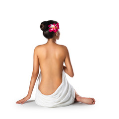 Obraz na płótnie Canvas Asian woman wearing towel sitting on the floor