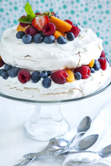 Meringue cake with fresh berries. Pavlova cake
