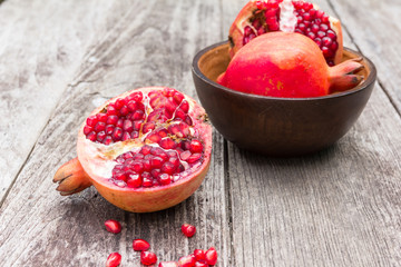 Juicy pomegranates on wood