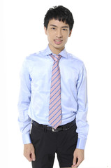 successful young business man standing with hands