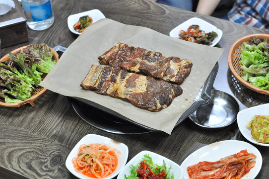 korean barbecue cuisine with side dishes served on table