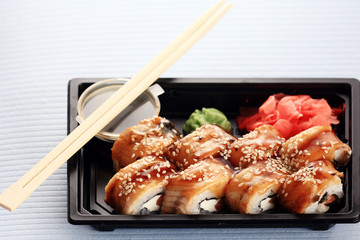 delivery service Japanese food rolls in plastic box