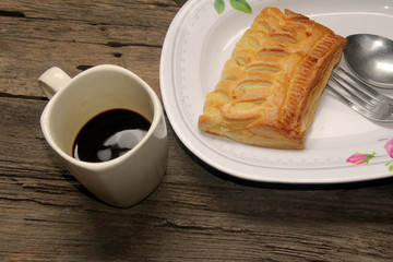 pie and coffee cup on a wood table