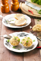 Baked eggs, stuffed with ham and parsley