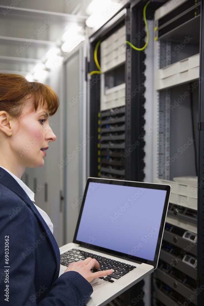 Aufkleber pretty technician using laptop while working on servers